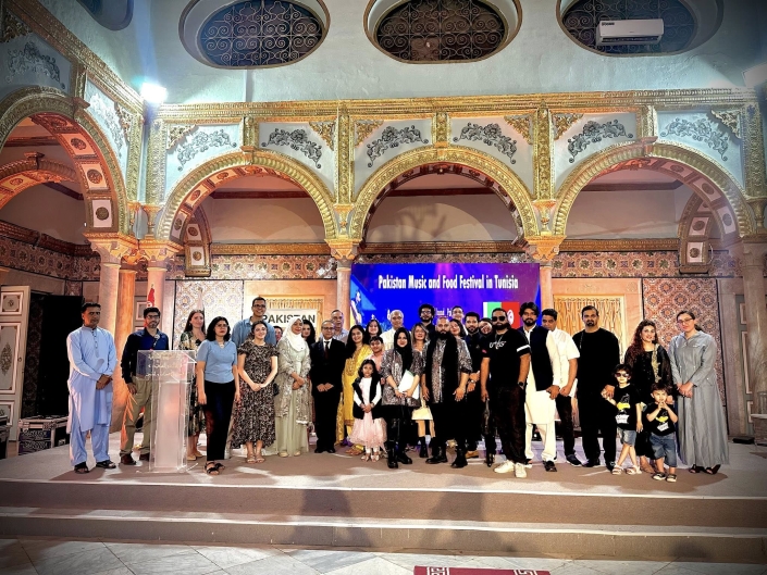 Group photo of Sawaal Band with Pakistani and Tunisian audience at cultural event in Tunisia